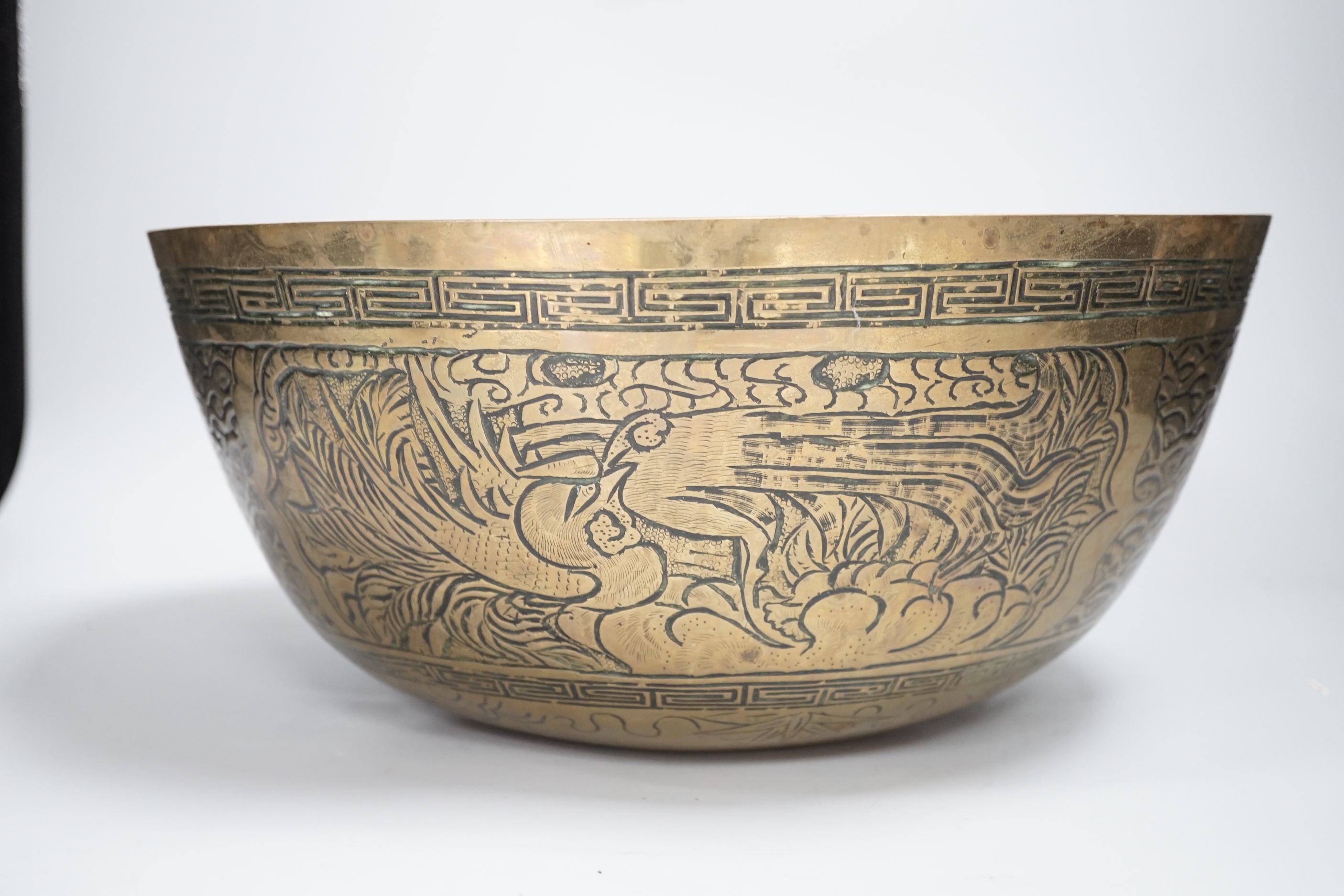 A Chinese brass ‘dragon’ engraved bowl, early 20th century, 33cm diameter